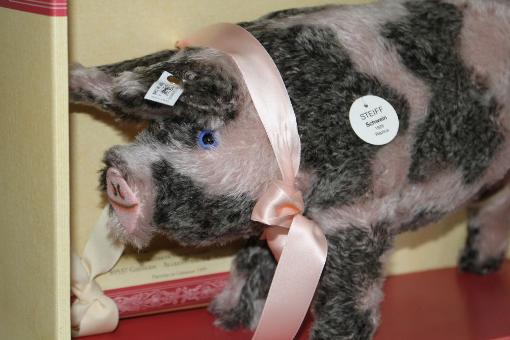 A group of assorted soft toy pigs including Steiff